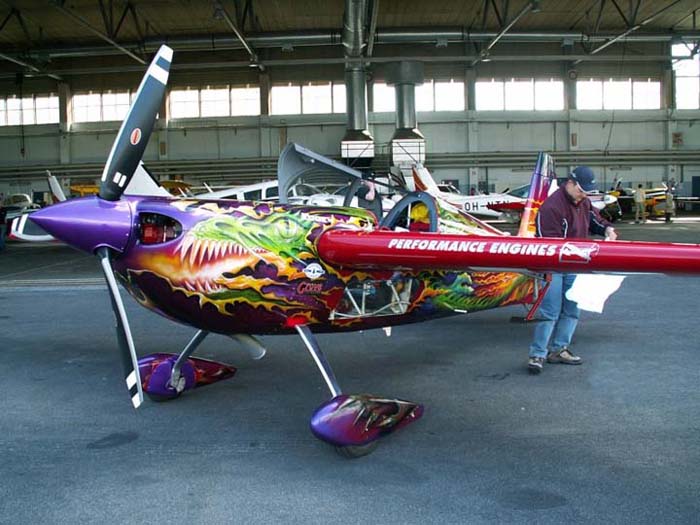 Red Bull Air Race 2005 Champion Mike Mangold checks out his FoMA T-shirt next to his gorgeous Zivko Edge 540. (Photo: Tero Auranen)