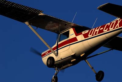 OH-COX of Malmi Aviation Club sneaking past to a touch-and-go. The Gomolzig silencer can be seen under the fuselage. Photo: Santtu Salomaa / Malmi Aviation Club